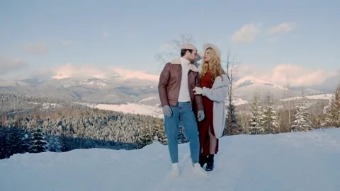 Couple on the background of snow-capped mountains Video stock 150681693