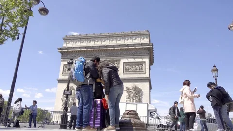 Couple with backpack tourists standing in front of Arc de Triomphe Paris France Stock Footage 93812746