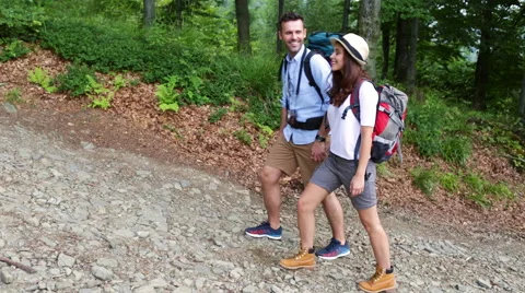 Couple of backpackers going up the mountain Stock Footage 52779586
