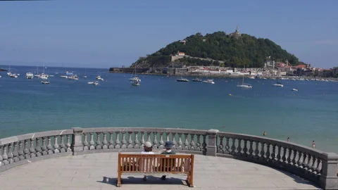 Couple in a balcony looking at the sea Stock Footage 162485902