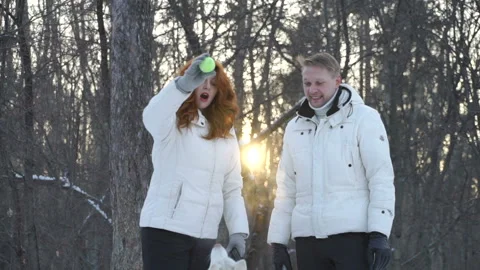 Couple with ball playing with dog Stock Footage 87374809