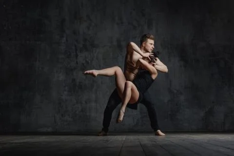 Couple of ballet dancers posing in studio Stock Photos