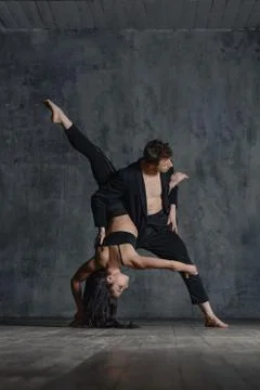 Couple of ballet dancers posing in studio Stock Photos