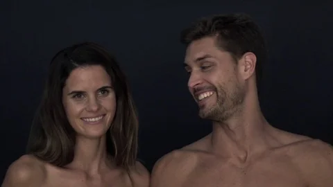 Couple with bare shoulders smiling cheerfully Stock Footage 75191632