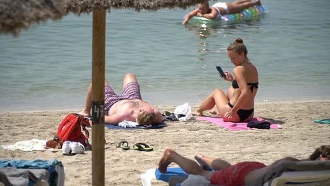 Couple at the beach Stock Footage 128348194