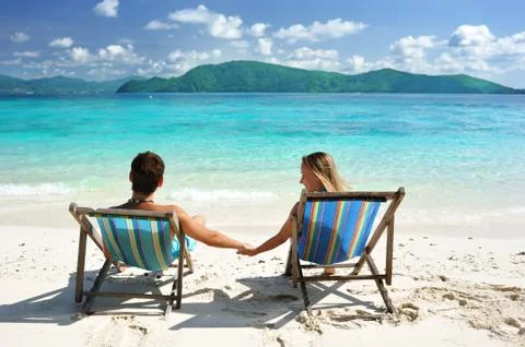 Couple on a beach Stock Photos