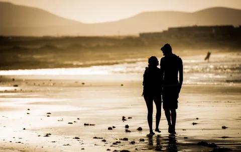 Couple on the beach Stock Photos