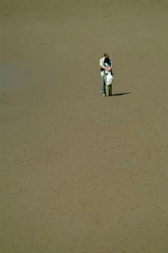 Couple on a beach Stock Photos