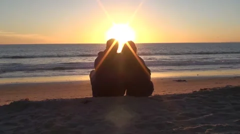 A Couple at the Beach at sunset Stock Footage 48919350