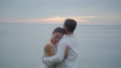 Couple in beach sunset hugging Video stock 230582122