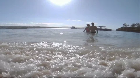 Couple on beach in the water Stock Footage 127471435