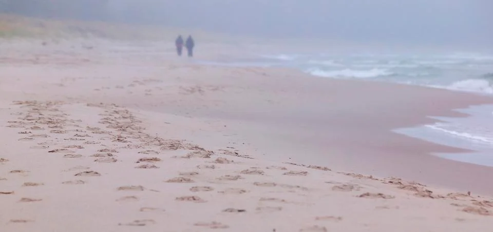 Couple on the beach.gn Stock Photos