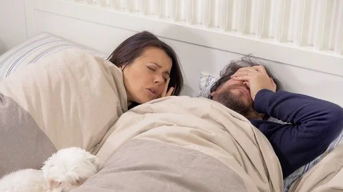 Couple in bed feeling sick with flu and fever slow motion Stock Footage 84775072