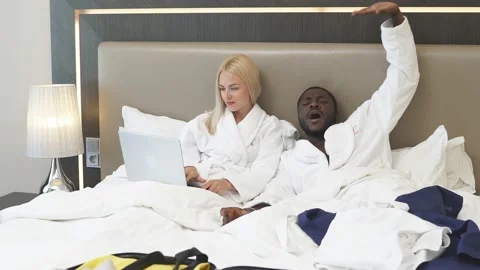 Couple on bed in hotel. Stock Footage 139391244