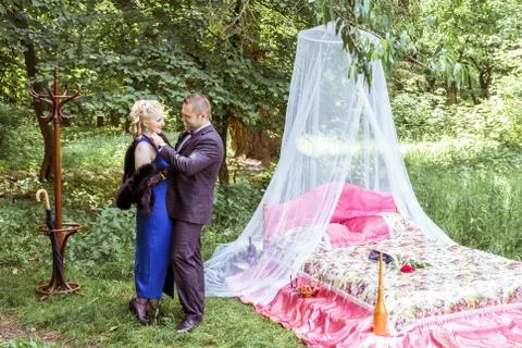 A couple by bed in meadow Stock Photos