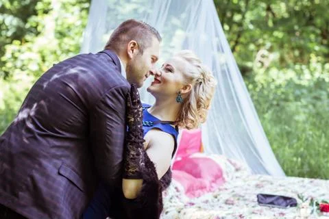 A couple by bed in meadow Stock Photos