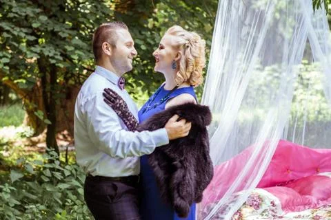 A couple by bed in meadow Stock Photos