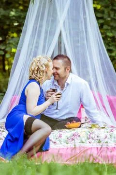A couple on bed in meadow Stock Photos