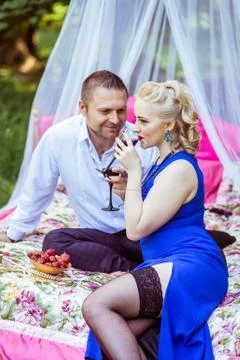 A couple on bed in meadow Stock Photos