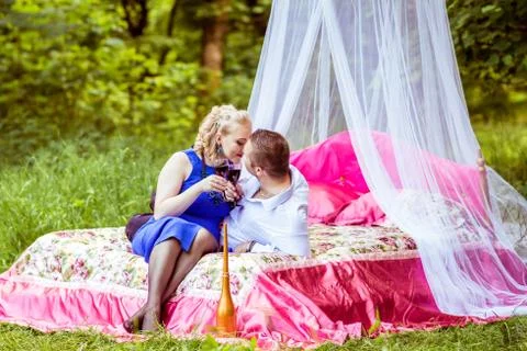 A couple on bed in meadow Stock Photos