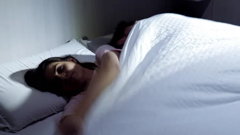 Couple in bed at night fighting about blanket funny comedy Stock Footage 149743346
