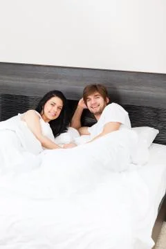 Couple at bed Stock Photos