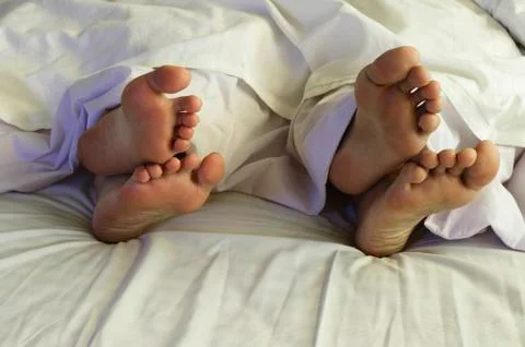 Couple in bed Stock Photos