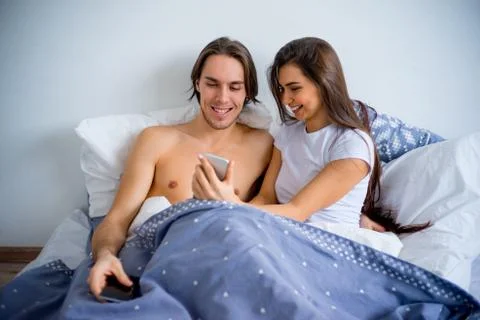 Couple in bed Stock Photos