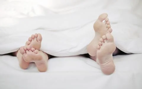 Couple in bed Stock Photos