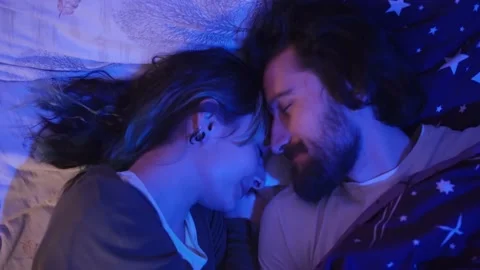 Couple in Bed Preparing for Sleep Night 動画素材 145844138
