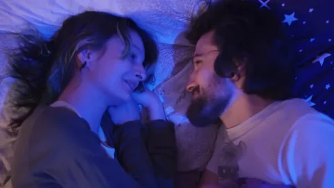 Couple in Bed Preparing for Sleep Night Stock Footage 145844193