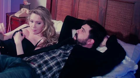 Couple in bed talking Stock Footage 105852457
