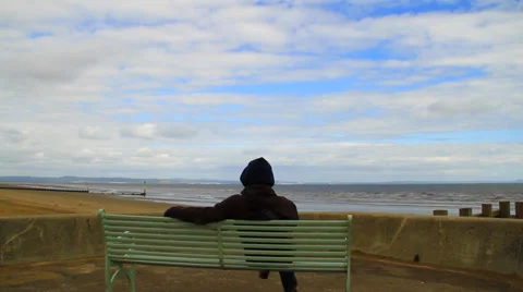 Couple from behind on a bench looking the see Stock Footage 39454004