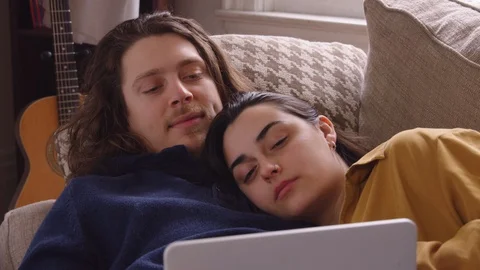 Couple being entertained by content playing from tablet. Stock Footage 129897898