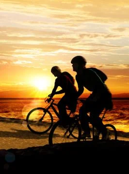 Couple on bicycles Stock Photos