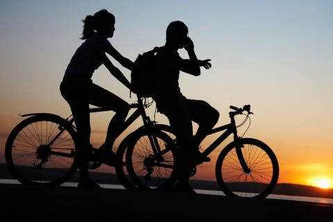 Couple on bicycles Stock Photos