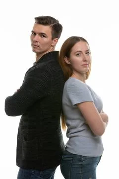 A couple with big problems stand with their backs to each other and look i... Stock-Fotos