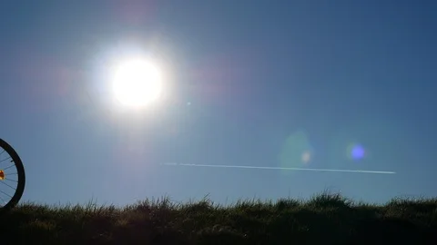 Couple biking in backlight sun Video stock 108444674