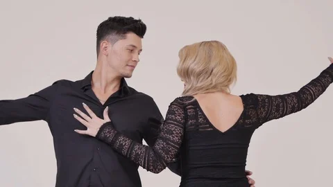Couple in black Clothes Dancing Together Stock-Footage 87975944