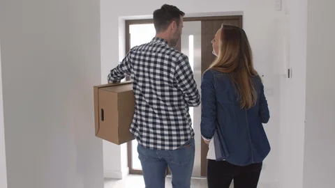 Couple with boxes moving out Stock Footage 90035490