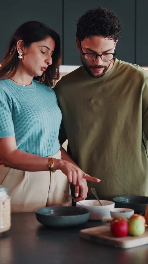 Couple, breakfast and meal prep in kitchen with cereal, chat and bonding Vídeo Stock 346947045