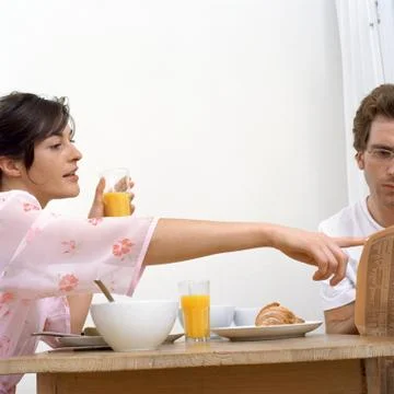 Couple at breakfast table Stock Photos