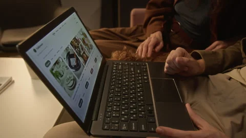 Couple Browsing E-commerce Website on Laptop for Online Shopping Stock Footage 344865253