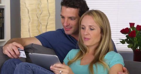 Couple browsing the web on tablet Video stock 44479772