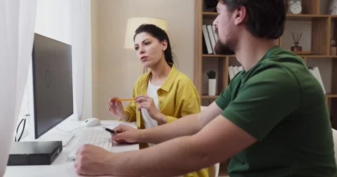 Couple budgeting at home using computer dashboard for planning savings expenses Stock Footage 336005660