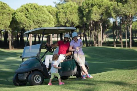 Couple in buggy on golf course Fotos Stock