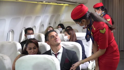 Couple business passengers forget  do not wearing protective face mask sittin Stock Footage 147237592