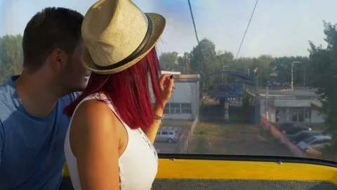 Couple on cable car going down on the ground Stock Footage 71355935
