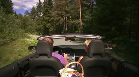 A couple in a cabriolet Stock Footage 11308324