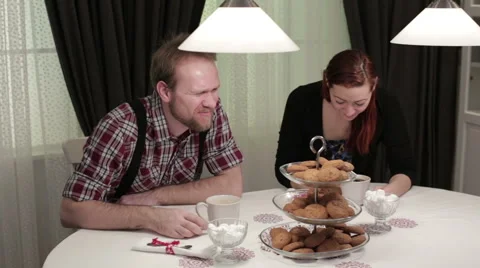 Couple in a cafe drinking coffee with cookies Stock Footage 62874253